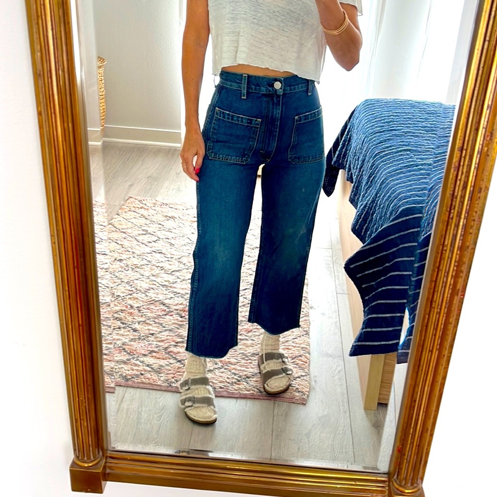 AMO patch pocket jean w frayed hem.